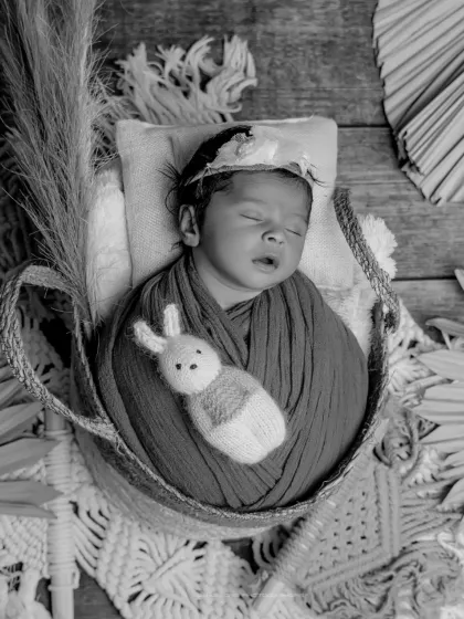 A timeless black and white portrait. This boho-inspired setup, with its rich textures, looks stunning and classic in monochrome.