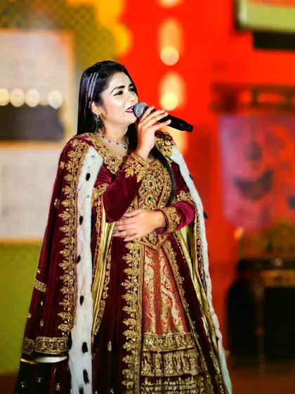 Dressed for a grand destination wedding in Udaipur. I believe my on-stage presence and attire should match the grandeur of your event, adding a touch of royalty and elegance to the celebration.