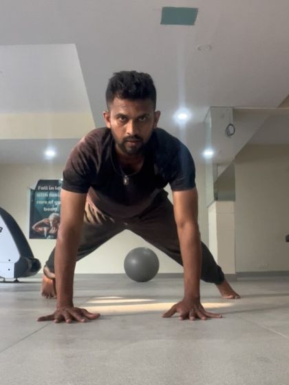 A wide-stance pushup, focusing on the outer chest and shoulders. I always look for ways to vary my training.