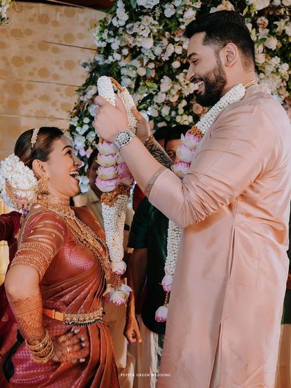The playful garland exchange, a moment of fun and laughter during the wedding ceremony.