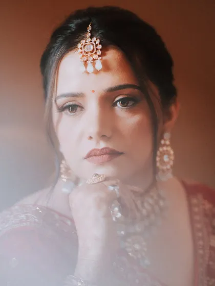 What a lovely, dreamy portrait of my bride Sonia. For her wedding, we went with a classic red lip and soft brown smokey eyes.