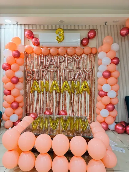 Another view of the lovely peach-themed 3rd birthday decoration.