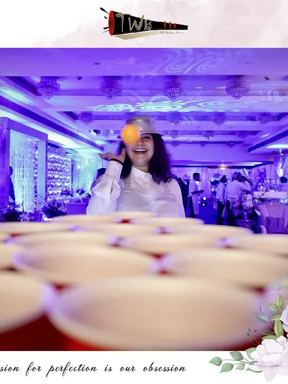 A guest enjoys a game of beer pong at our bar, highlighting the interactive experiences we create.