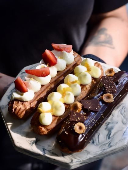 A platter of our seasonal eclairs, including the Orange & Vanilla, Strawberry & Cream, and Chocolate Hazelnut Praline.