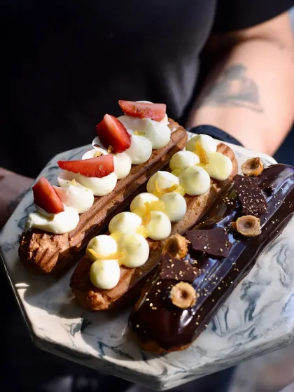 A platter of our seasonal eclairs, including the Orange & Vanilla, Strawberry & Cream, and Chocolate Hazelnut Praline.