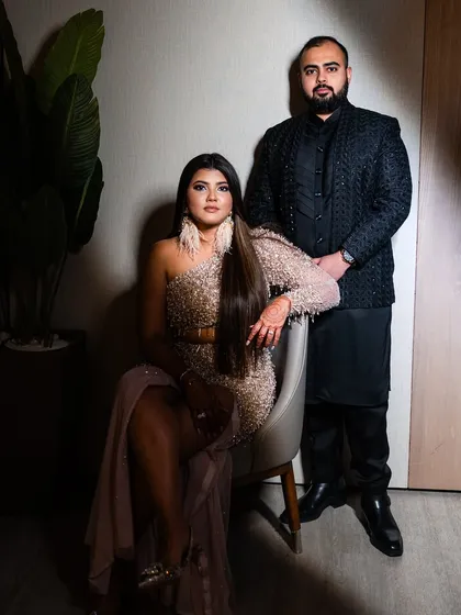 Another stunning shot of the couple. The dramatic lighting highlights the flawless finish of Kajol's party makeup.