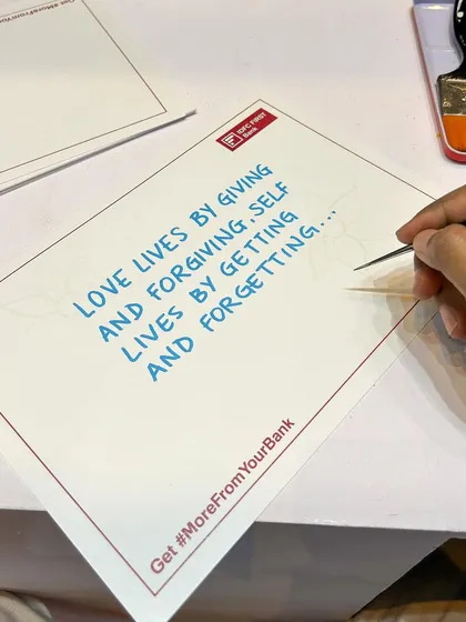 At an IDFC First Bank event, I created 230 personalized artworks in just two days. Using invisible ink that revealed a storyline, I then added my fine-liner details to create unique takeaways for each attendee.