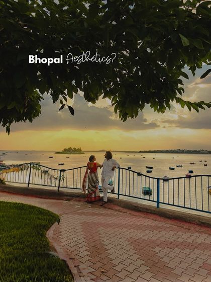 Bhopal Aesthetics. A couple enjoying the sunset view over the lake, a perfect representation of the city's romantic charm.