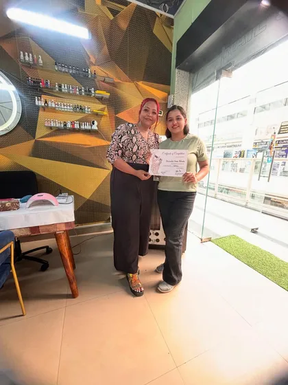 A proud moment with a newly certified nail technician. My small class sizes mean we build a great connection, and I'm here to support you even after the course ends.