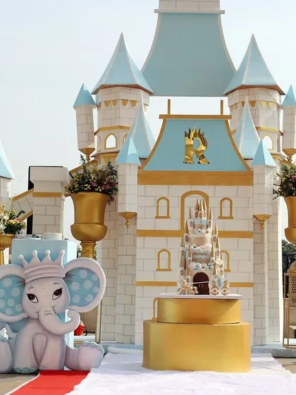 The centrepiece of this Winter Wonderland party was a magnificent custom-built castle. Paired with a cute baby elephant prop and a giant number '1', it created a breathtaking focal point for a prince's first birthday.