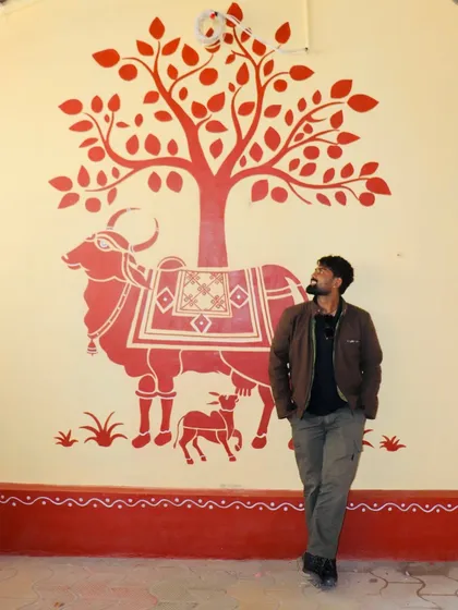 Using traditional Indian art forms like Warli, I tell timeless stories. This mural depicts Kamadhenu, the sacred cow, in the classic, minimalist Warli style, bringing a sense of heritage and peace to the space.