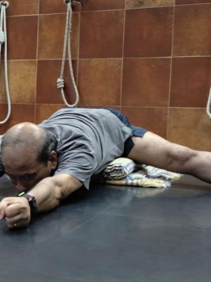 A forward bend in Upavistha Konasana.