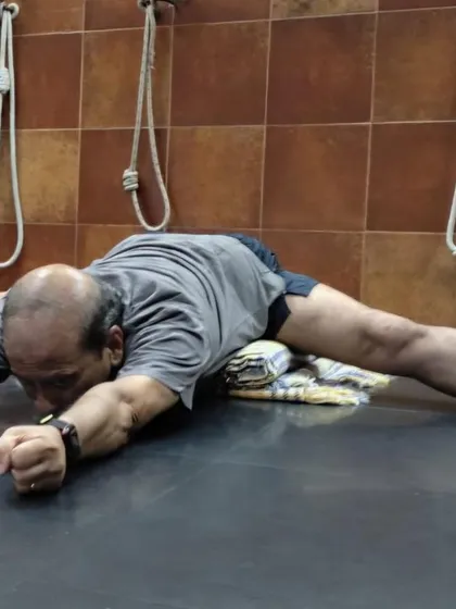 A forward bend in Upavistha Konasana.