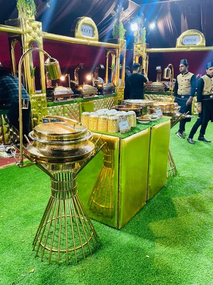 The elegant gold-themed Mughlai food station, showcasing the luxurious presentation I bring to every event.