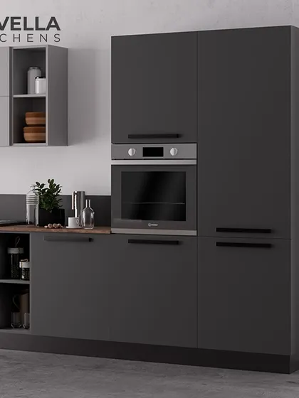 This image highlights a tall unit in a dark matte finish with an integrated oven. The handleless design and monochromatic color scheme are hallmarks of our sleek, German-style modular kitchens.