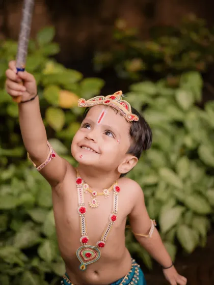 Looking up with wonder. I always try to capture a child's natural curiosity during our photoshoots, and this candid moment from the Krishna session is a perfect example.