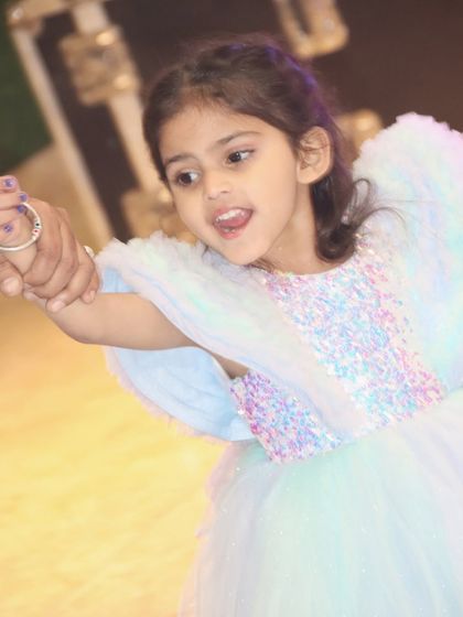 A candid shot of the birthday girl dancing and enjoying her party.