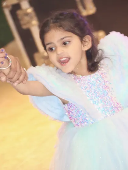 A candid shot of the birthday girl dancing and having fun. My goal is to capture the energy and movement of the party.