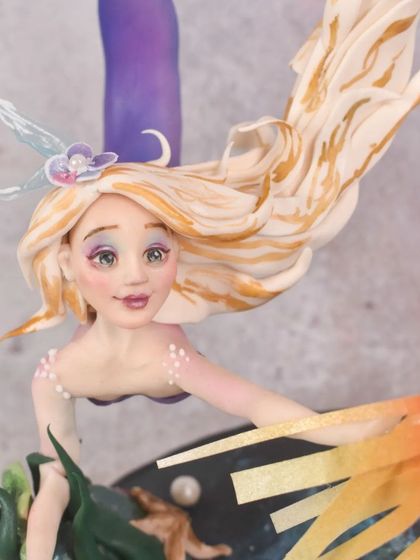 A close-up of the mermaid's face from my competition piece. I spent a lot of time painting her expressive eyes and adding delicate details like the blush on her cheeks and the shimmer on her skin.