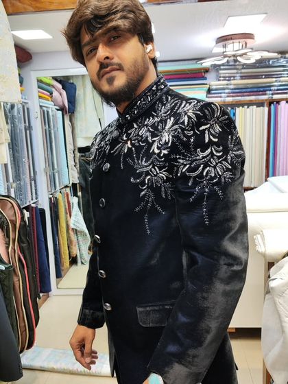 Another angle of the client in the navy blue velvet Jodhpuri, showing how the embroidery catches the light.
