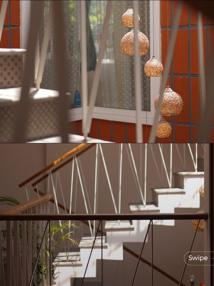 Details of the staircase, showing the patterned tile risers and the delicate hanging lights that add a touch of whimsy and elegance to the space.