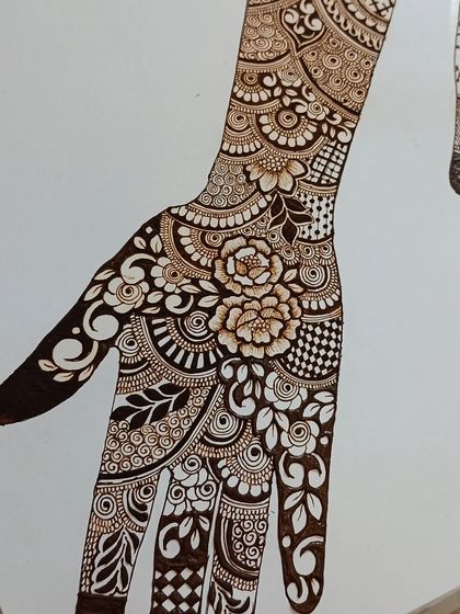 The completed floral bridal practice hand. This is the result of combining many different elements we learn, from flowers and leaves to various fillers and borders.