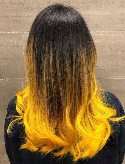 Make a bold statement with this black-to-yellow ombre. This look is not for the faint of heart and shows our expertise in creating high-contrast, vibrant color looks.