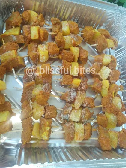 My succulent Kaadi Gosh, or beef sticks, marinated with pineapple and spices, ready for frying. The combination of tender beef and tangy pineapple is a classic favorite.