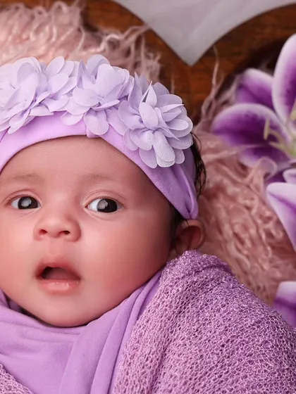 A precious close-up of the baby's awake and expressive face. So much personality in such a tiny person!