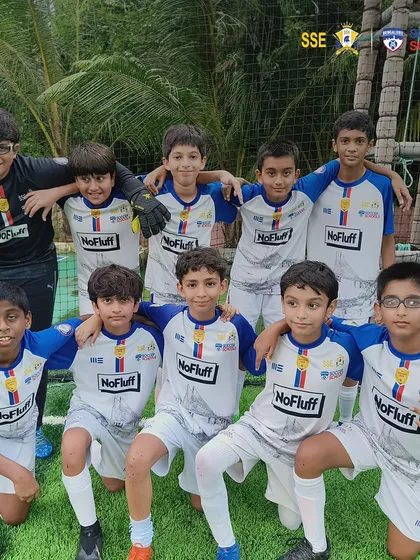 Our U13 players posing for a team photo. The friendships and memories made during these tournaments last a lifetime.