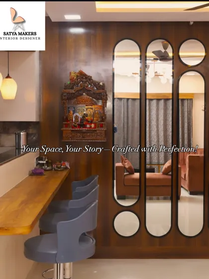 A traditional wooden mandir mounted on the wall, creating a focal point next to the breakfast bar in this open-plan home.