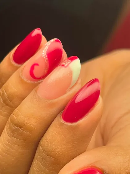 A creative twist on the French manicure, incorporating an abstract swirl design into the tip.