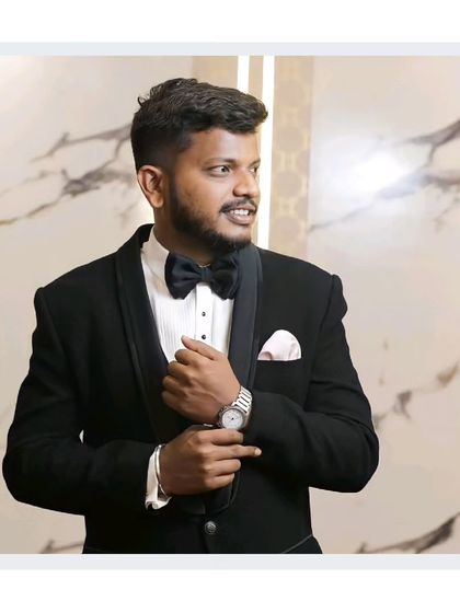 Dapper looks without the commitment. Our client looks ready for his reception in this classic black tuxedo with a bow tie.