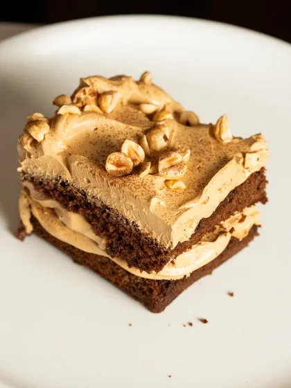 For a more grown-up indulgence, I present my Rum Soaked Dark Chocolate Traybake. This egg-free dessert features a rich dark chocolate sponge soaked in rum, layered with an airy coffee mousse, and finished with the crunch of toasted hazelnuts.