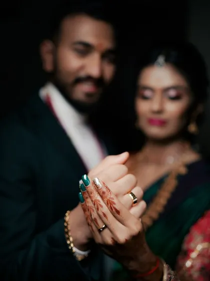 A detail shot focusing on the couple's hands and their new engagement rings. This soft-focus, intimate photo is a beautiful way to announce your commitment and remember the special day.