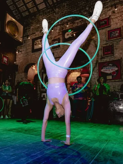 Combining my love for acrobatics and hooping with this handstand during a performance. It’s a move that took a lot of practice, but it shows how strength and flow can come together in an exciting way.