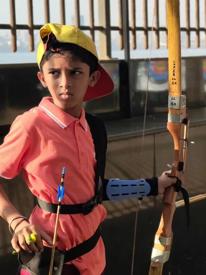 A young archer looking confident with his bow. Our goal is to build self-esteem and a lifelong passion for the sport.