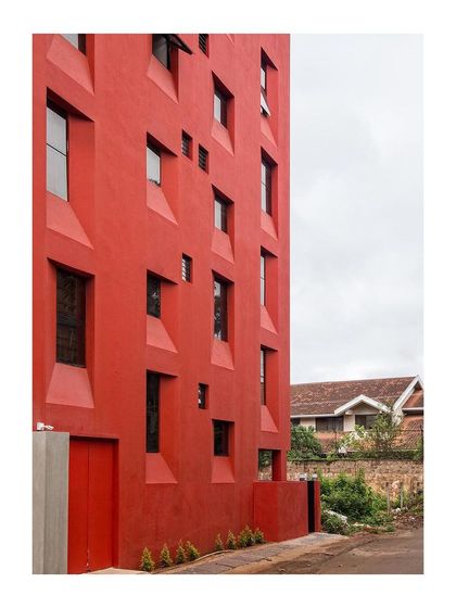 This side view of the "Stacked Student Housing" shows how the building negotiates its relationship with the adjacent properties, maintaining privacy through careful window placement.