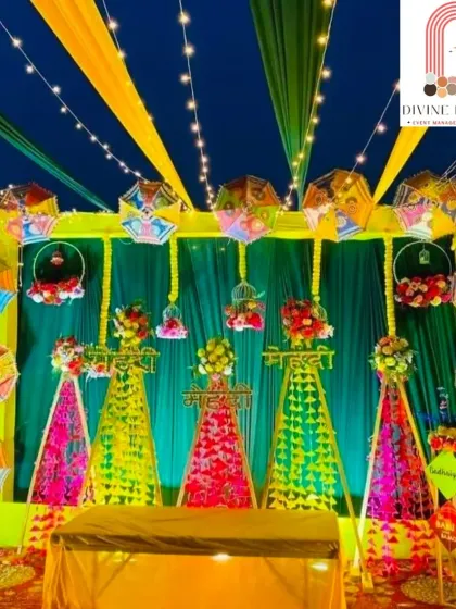 Mehendi nights are all about fun and colour. I designed this vibrant outdoor setup with a mix of colourful drapes, traditional Rajasthani umbrellas, and glowing string lights to create a festive and energetic backdrop perfect for dancing and celebration.