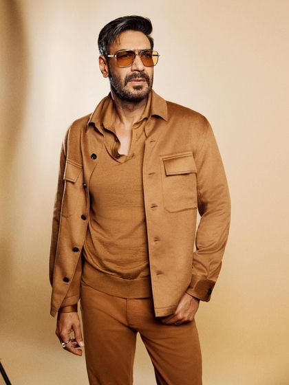 A full-length view of the tonal brown outfit, a masterclass in sophisticated, modern menswear.