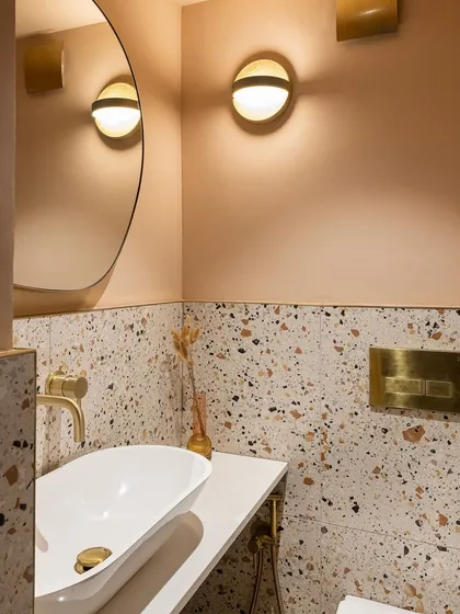 Terrazzo continues to be a popular choice for its playful yet sophisticated look. It's a versatile material that works well in bathrooms and on countertops.