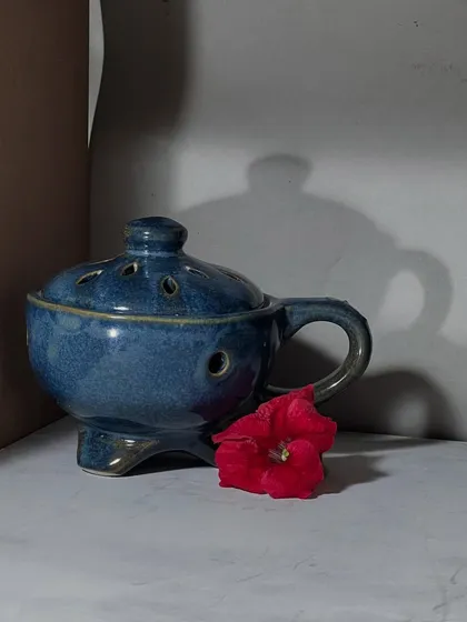 The actual still life setup that I painted from. Seeing the reference next to the painting shows how I interpret the scene rather than just replicating it.