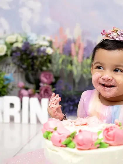 Nothing says "happy first birthday" like a messy cake smash. We capture the pure joy and delightful chaos as your baby dives into their first cake, creating fun-filled memories in a beautiful, pastel-themed setting.