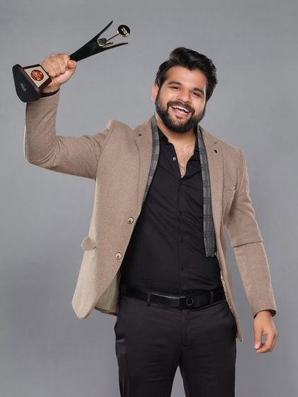 A celebratory shot of Kshitish Date with his award. The outfit was designed to be stylish yet comfortable for the entire event.