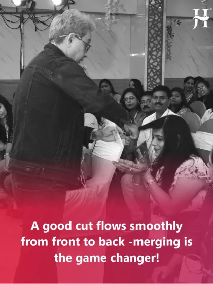 Here I am demonstrating my cutting technique to an audience. A good cut is not just about length; it flows smoothly from front to back. Merging the sections is the game changer.