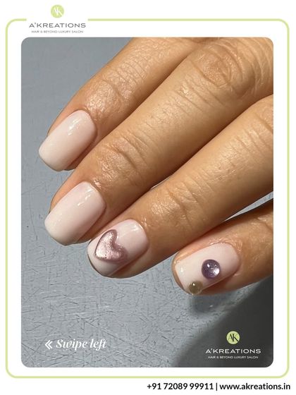 Another angle showcasing the subtle beauty of our 3D heart and pearl embellished manicure, perfect for a touch of quiet luxury.