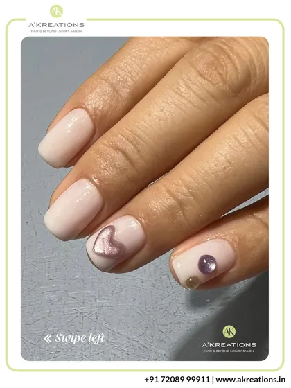 Another angle showcasing the subtle beauty of our 3D heart and pearl embellished manicure, perfect for a touch of quiet luxury.