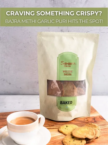 Craving something crispy? My baked Bajra Methi Garlic Puri hits the spot. This image shows the puris next to a cup of chai, a perfect pairing.
