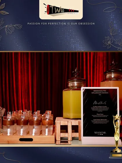 A sleek mocktail bar with infused water dispensers and branded glassware.