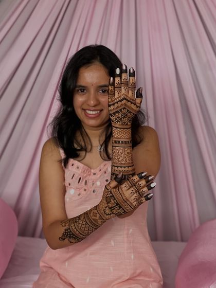 Rakshitha's happy smile as she shows off her fresh bridal mehendi. It's moments like these that make my work so rewarding.